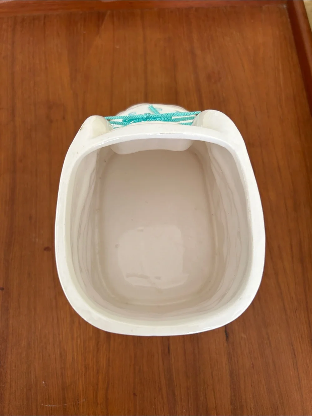 Vintage Ceramic baby bootie planter Embossed floral design and turquoise ribbon.